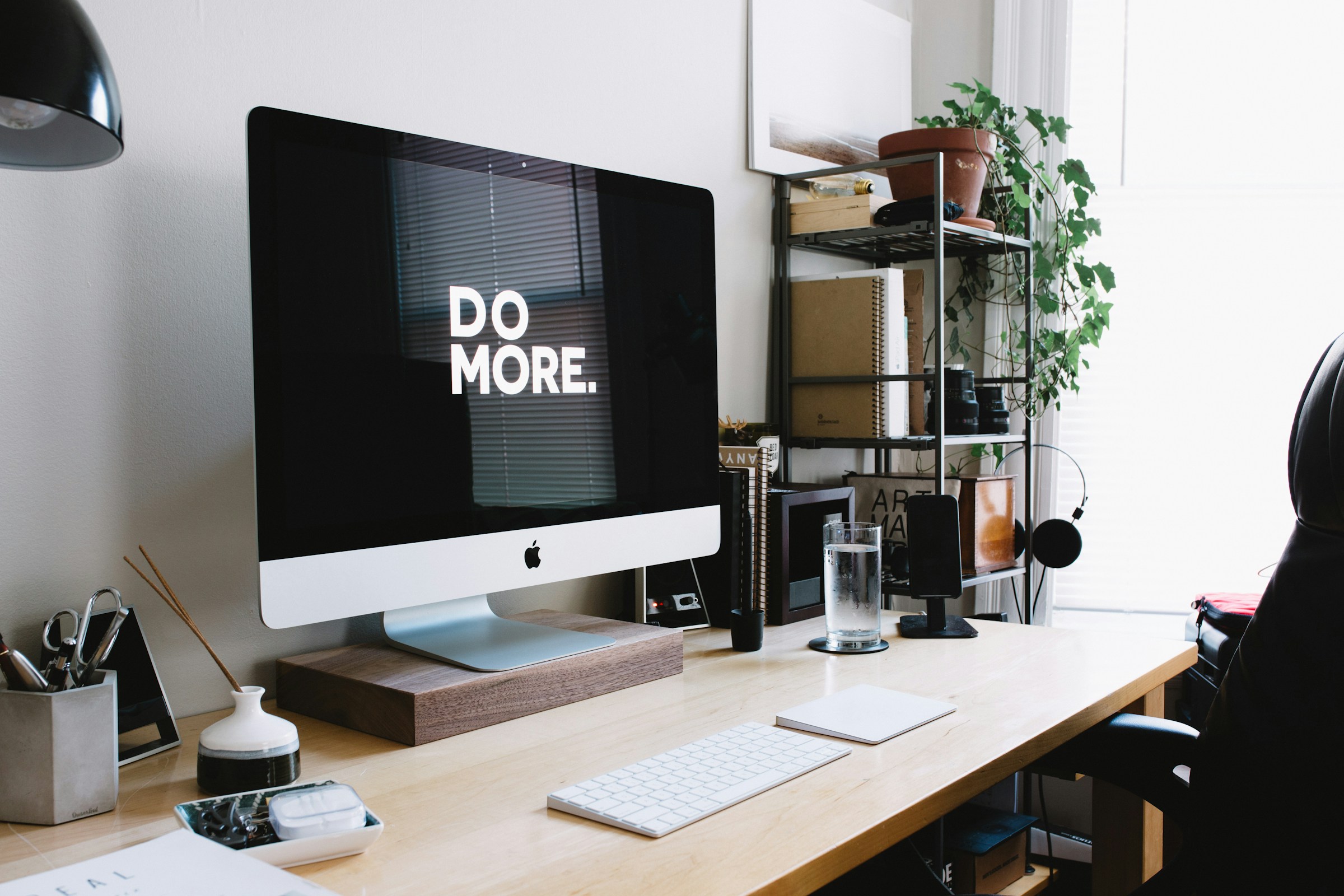 A laptop, a desk, a chair, a room